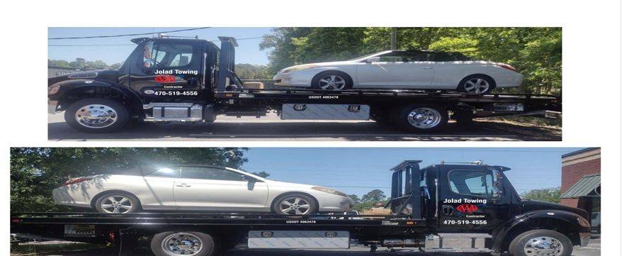 Jolad Towing rollback truck transporting a convertible vehicle